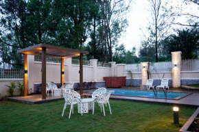 StayVista's Skylight Serenity with Modern Interiors, Outdoor Pool, Poolside Gazebo, Manicured Lawn
